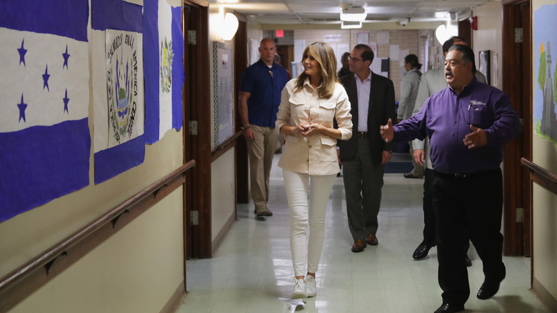 Melania Trump at an event in white skinny jeans