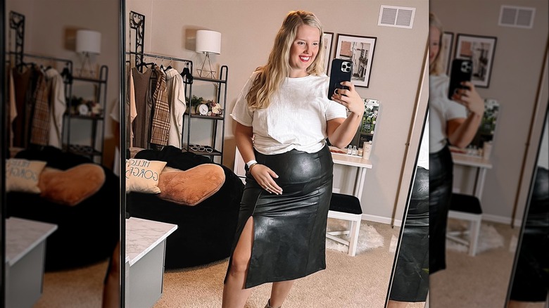 Woman in a leather mini skirt