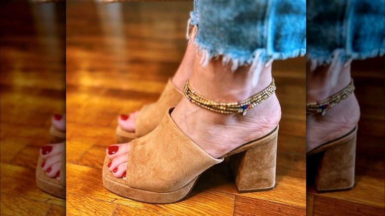 Person wearing tan heels and an anklet