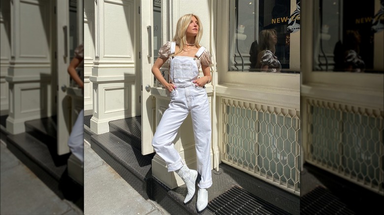 Women in white overalls and boots