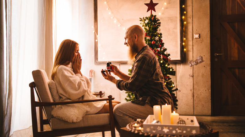 man proposing to woman on christmas