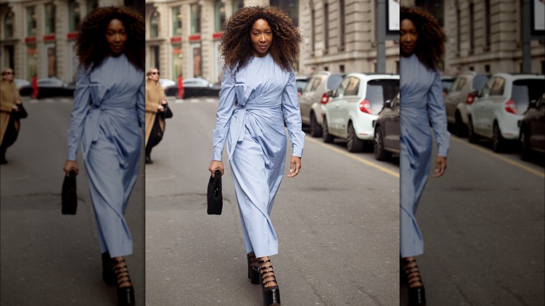 A woman in a pale blue dress 