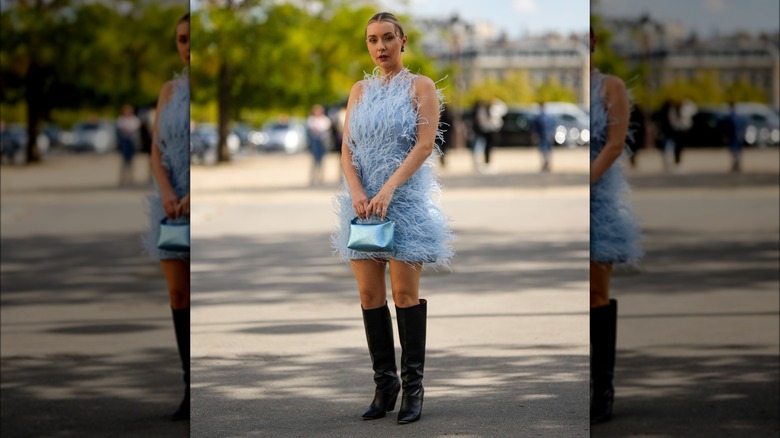 A woman in a pale blue dress 