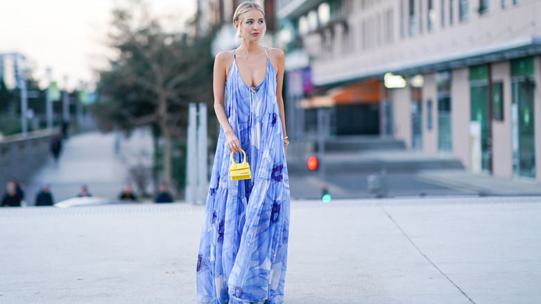 A woman in a pale blue dress 