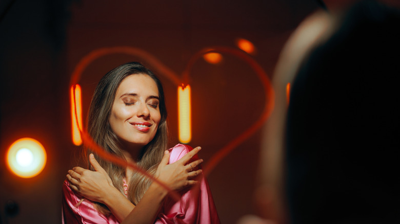 woman staring in mirror