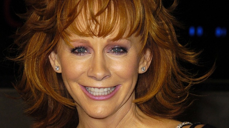 Reba McEntire wearing purple makeup