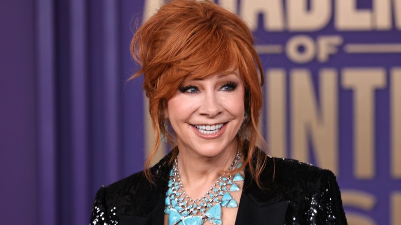 Reba McEntire smiling on the red carpet