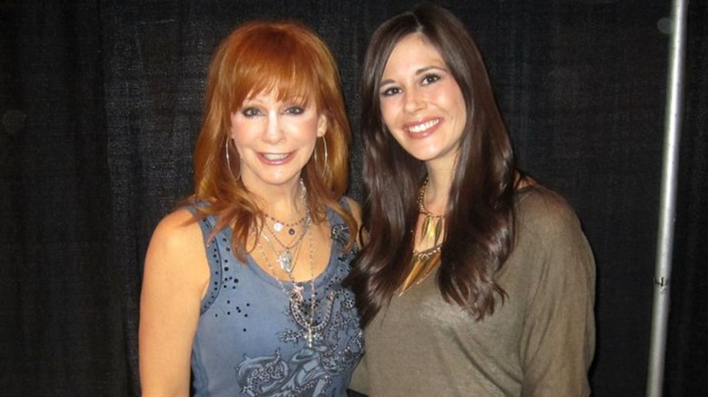 Reba McEntire with a powder flashback posing with a fan