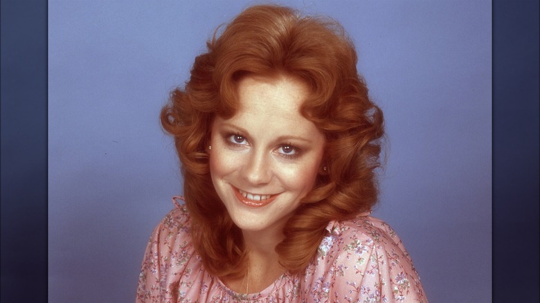 Young Reba McEntire smiling
