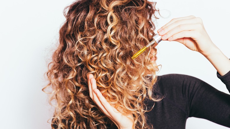 Serum applied to curly hair