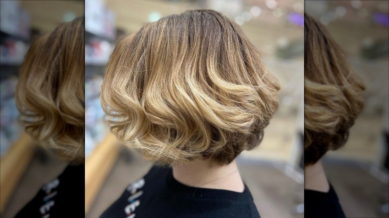 A person with a voluminous bob