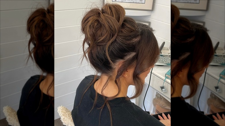 A woman with a textured, high bun