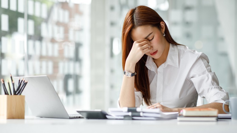Woman overwhelmed at work