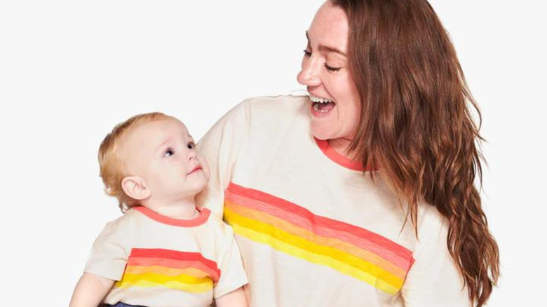 Woman and baby wearing Primary shirt