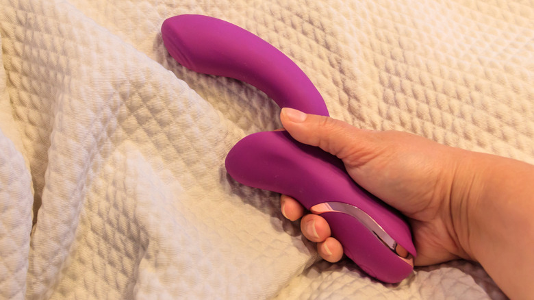 Hand holding vibrator