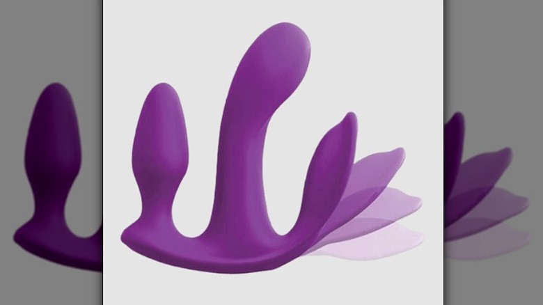 Purple sex toy with three penetration features