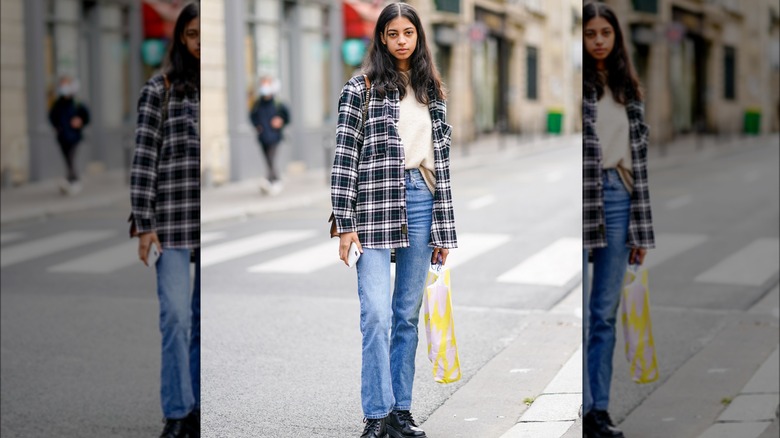 Woman in a plaid shacket and denim 