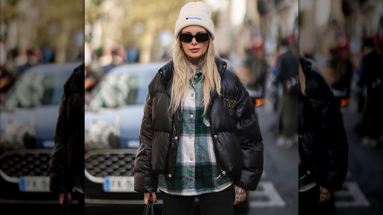Woman in plaid and puffer jacket 