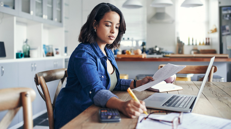 Woman working with expenses