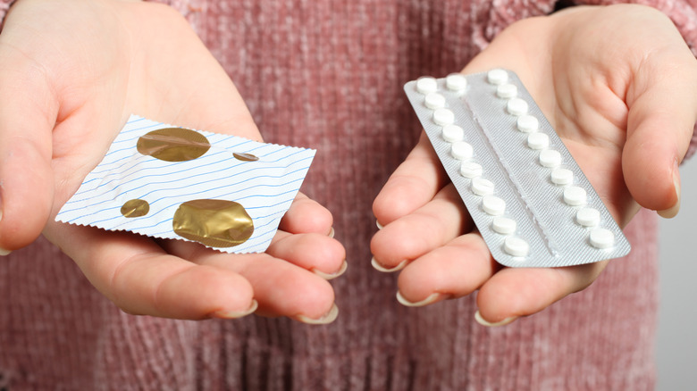 Woman holding contraception methods