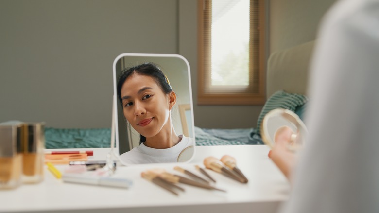 Woman applying powder