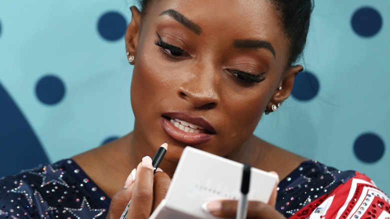 Simone Biles doing makeup