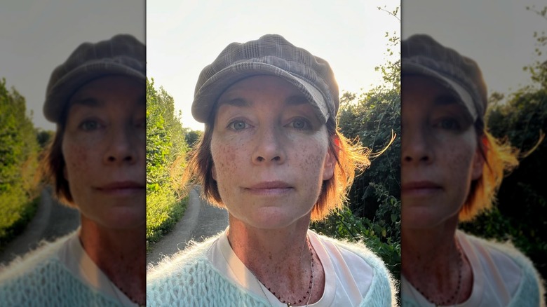 Julianne Nicholson wearing a hat in the sun selfie