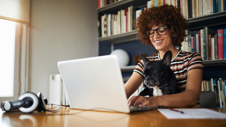 Employee working remote with dog