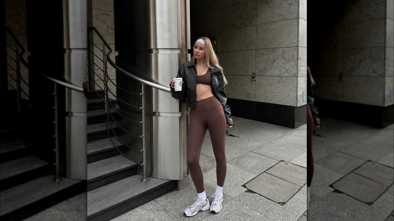 Woman in a crop top and leggings