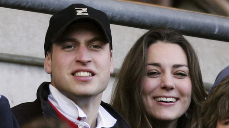 Prince William in a baseball cap and Kate Middleton at an event