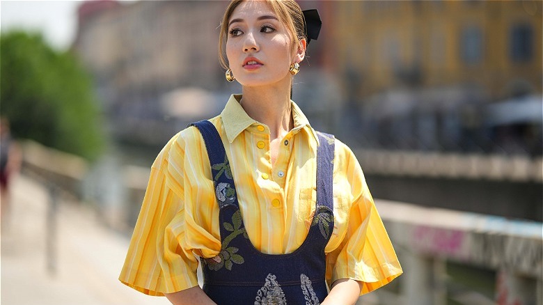 model in yellow striped shirt