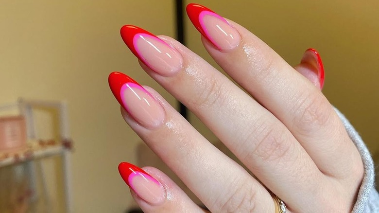 Red French manicure with pink border