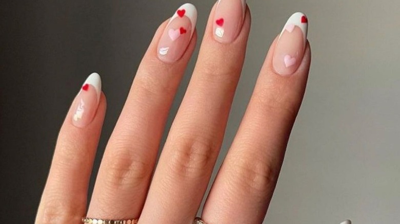 French manicure with red and pink hearts