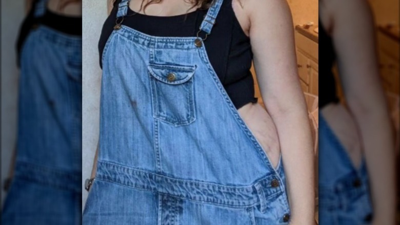 person modeling overalls
