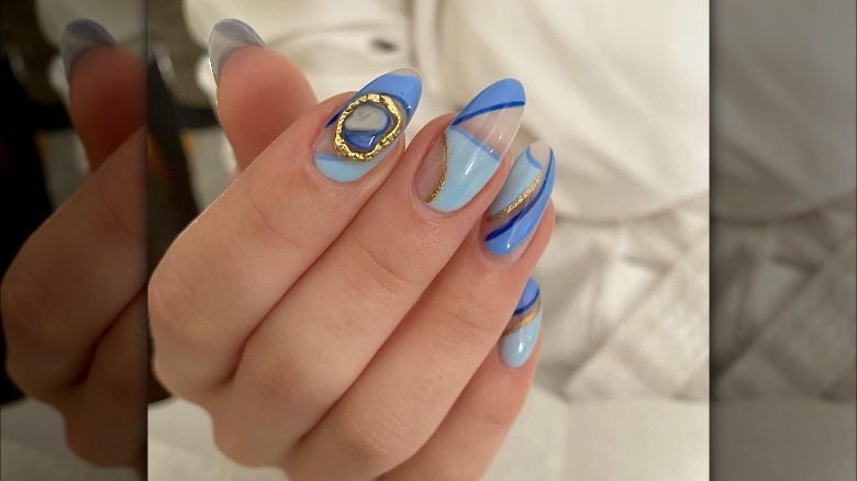 Blue nails with geometric designs