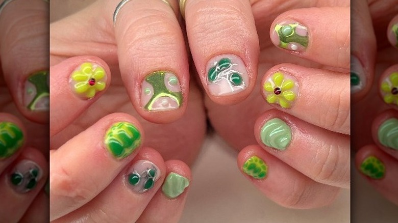Hands with green 3D manicure