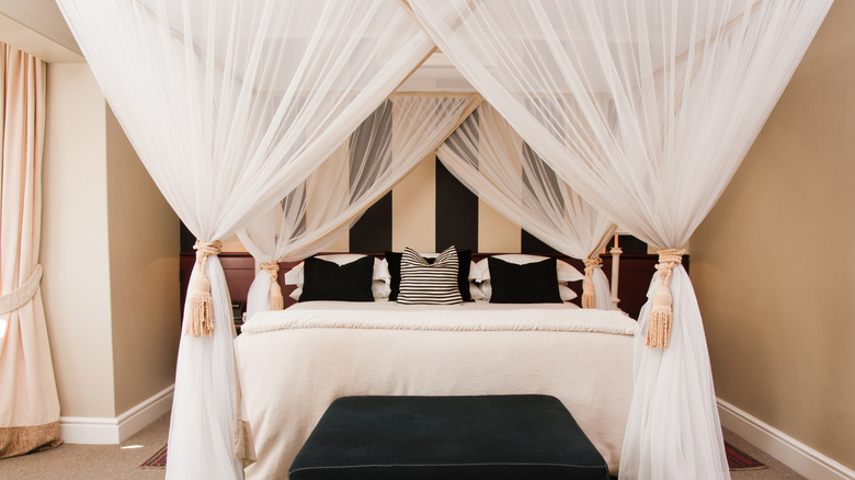 canopy bed with white cover