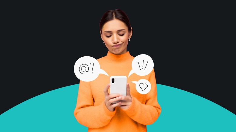 woman in orange sweater texting