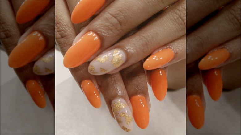 Tangerine manicure with accent nail