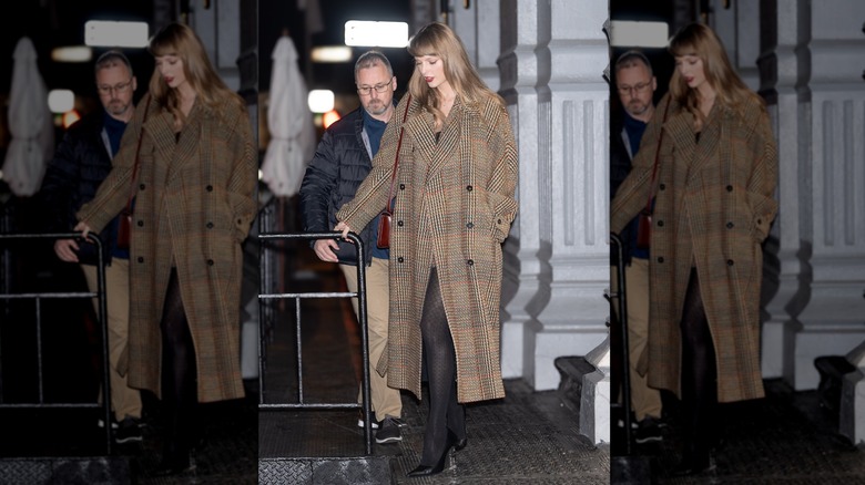 Taylor Swift walking in Manhattan in 2023 wearing a long, tweed jacket