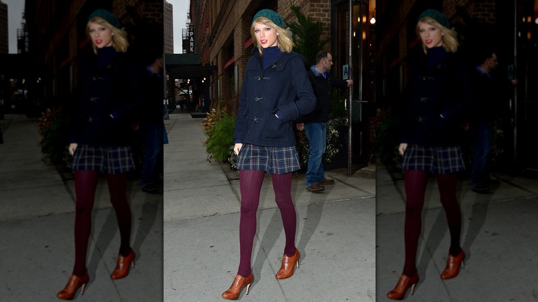 Taylor Swift in NYC in December 2014 wearing a plaid skirt