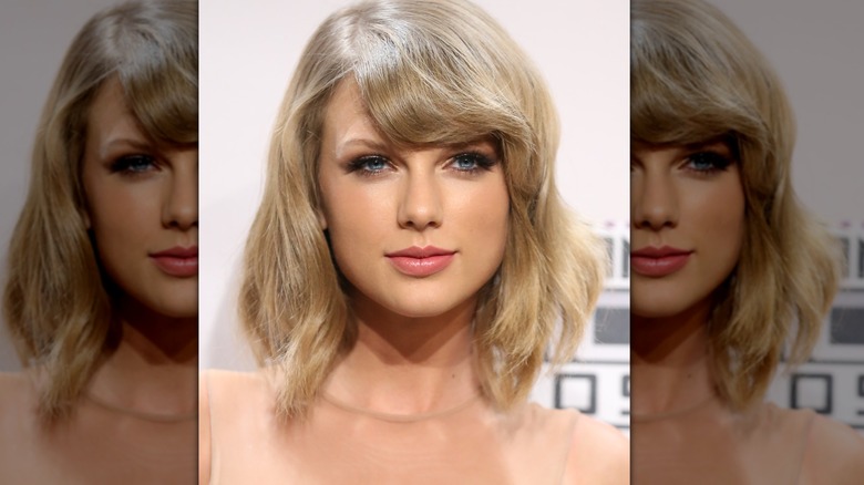 Close-up of Taylor Swift with a slightly wavy bob and side-swept bangs