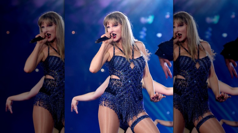 Taylor Swift onstage in a blue sparkly bodysuit