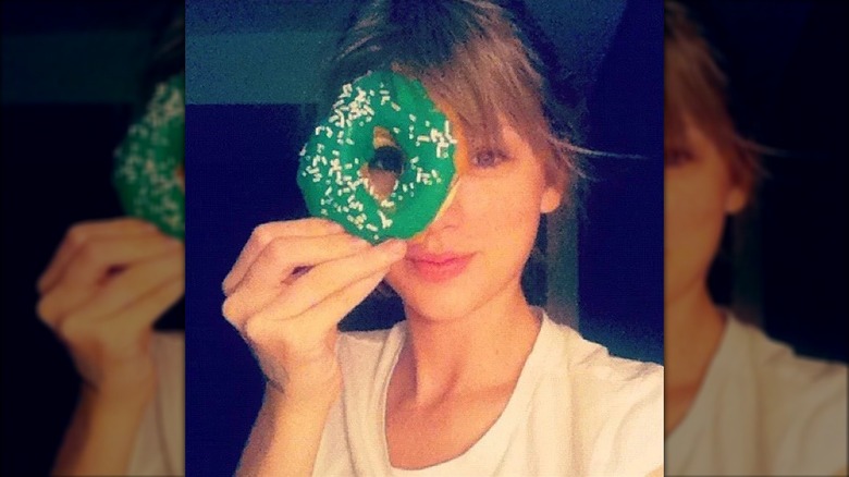 Taylor Swift with a donut