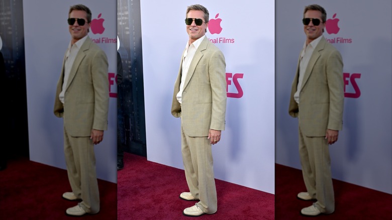 Brad Pitt in a beige suits