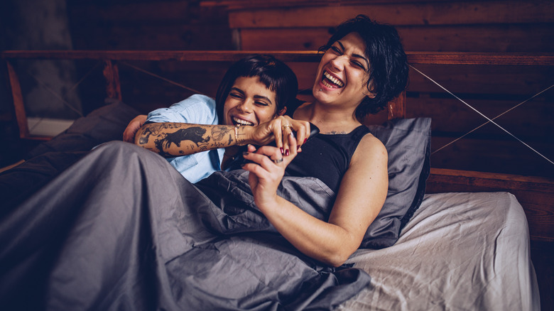Queer couple cuddling