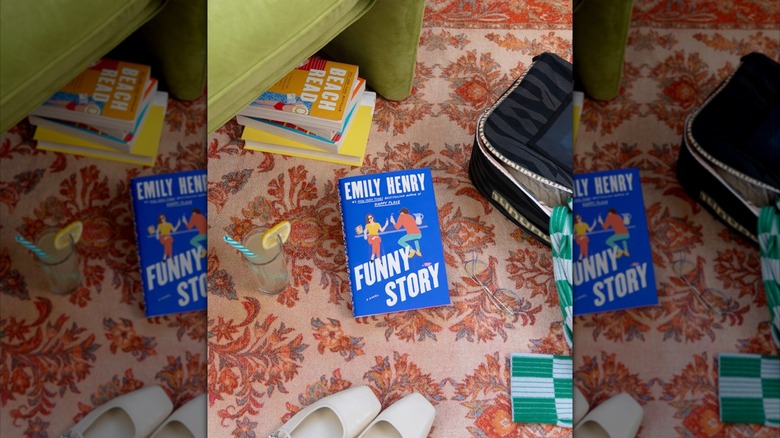 A copy of "Funny Story" laying on a patterned rug