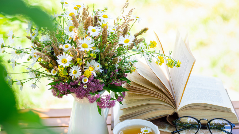 Spring flowers by a book