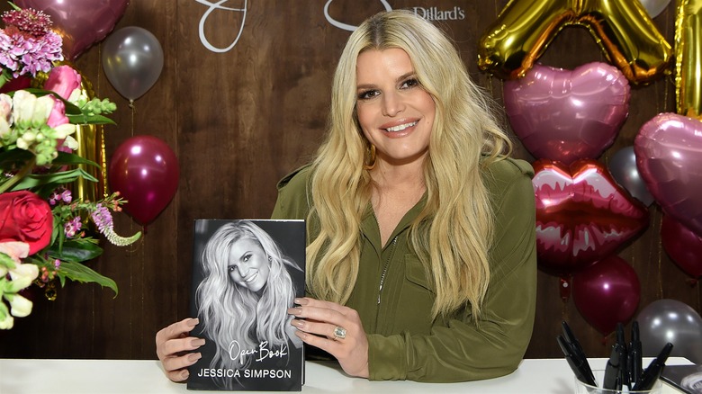 Jessica Simpson holding her book