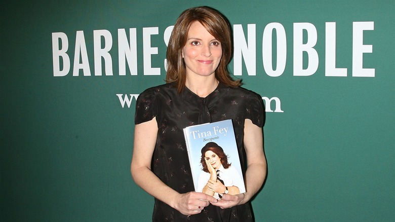 Tina Fey with her book